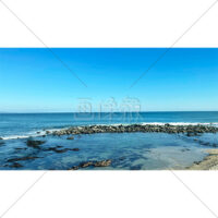 澄んだ青空と水平線の写真素材